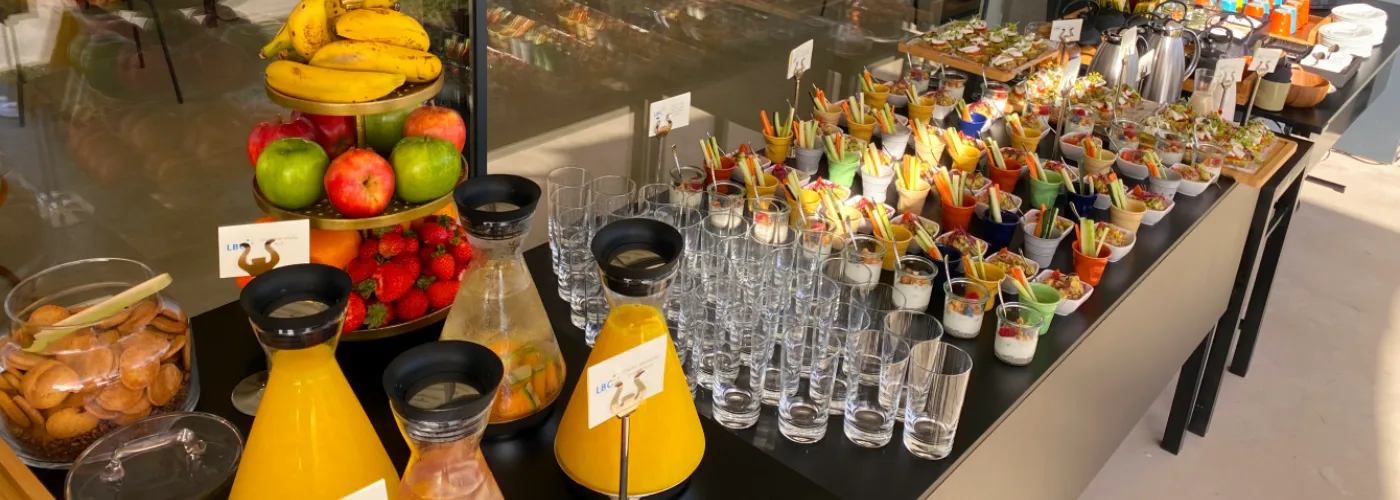 Vibrant healthy buffet with fresh fruits juices vegetable sticks and colorful appetizers