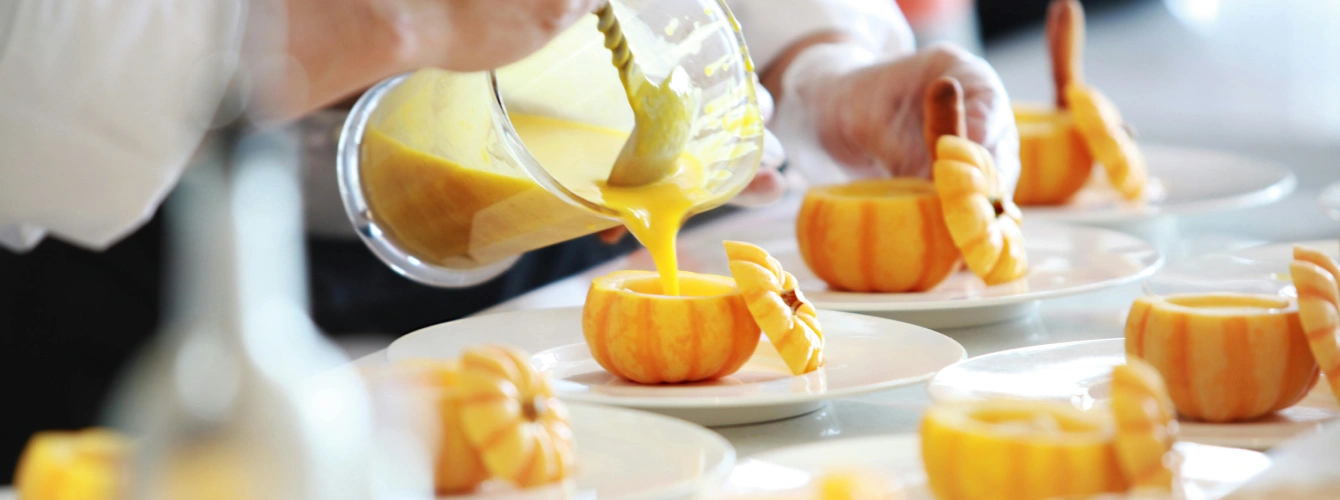Chef preparing creative pumpkin dishes for a corporate incentive catering