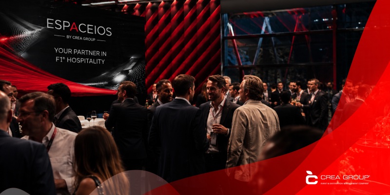 usiness professionals networking during an exclusive Espaceios Formula 1 hospitality corporate event by Crea Group.