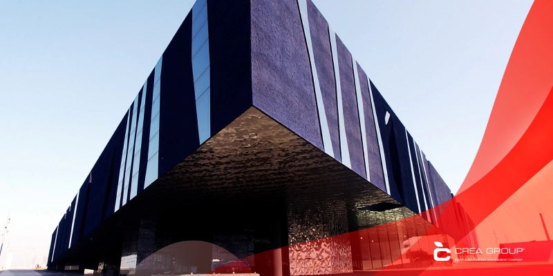 Barcelona CCIB triangular glass facade at sunset, Mediterranean seafront, top MICE venue Spain 2026