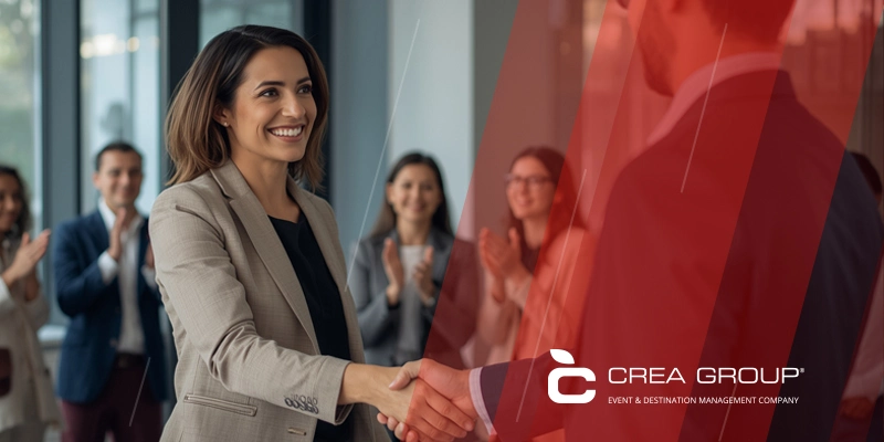 Diverse corporate team celebrating a successful incentive trip on a luxury rooftop terrace in Barcelona. Perfect example of what the best DMC in Spain can create for corporate events in 2026