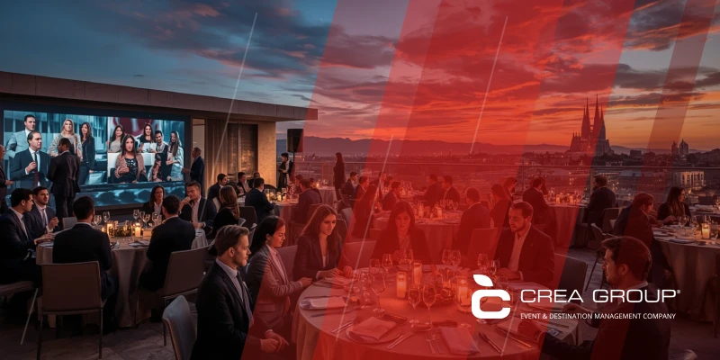 Vibrant corporate gala dinner on a Barcelona rooftop at dusk, showcasing CREA Group's MICE events expertise with networking professionals, Spanish tapas, and hybrid tech integration for incentives and conferences in Spain.