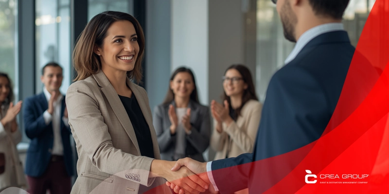 Diverse corporate team celebrating a successful incentive trip on a luxury rooftop terrace in Barcelona. Perfect example of what the best DMC in Spain can create for corporate events in 2026